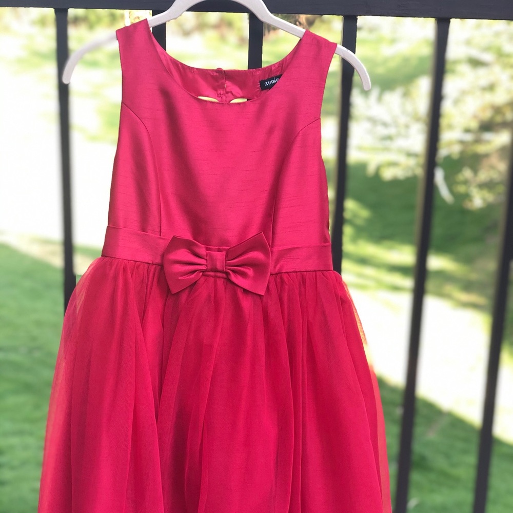 Girls red dress with bow in from and heart back